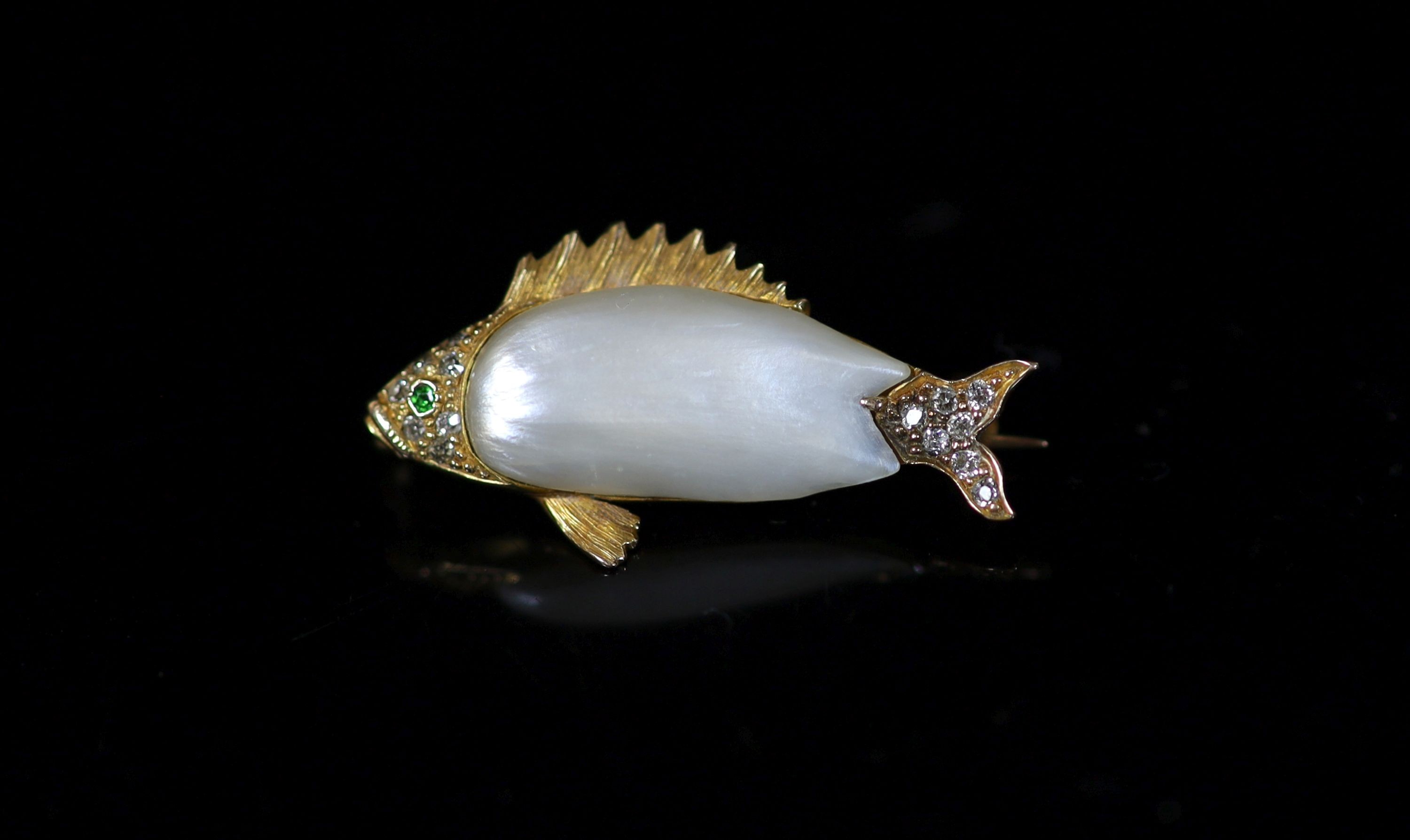 A gold, baroque pearl, garnet and diamond set brooch, modelled as a fish